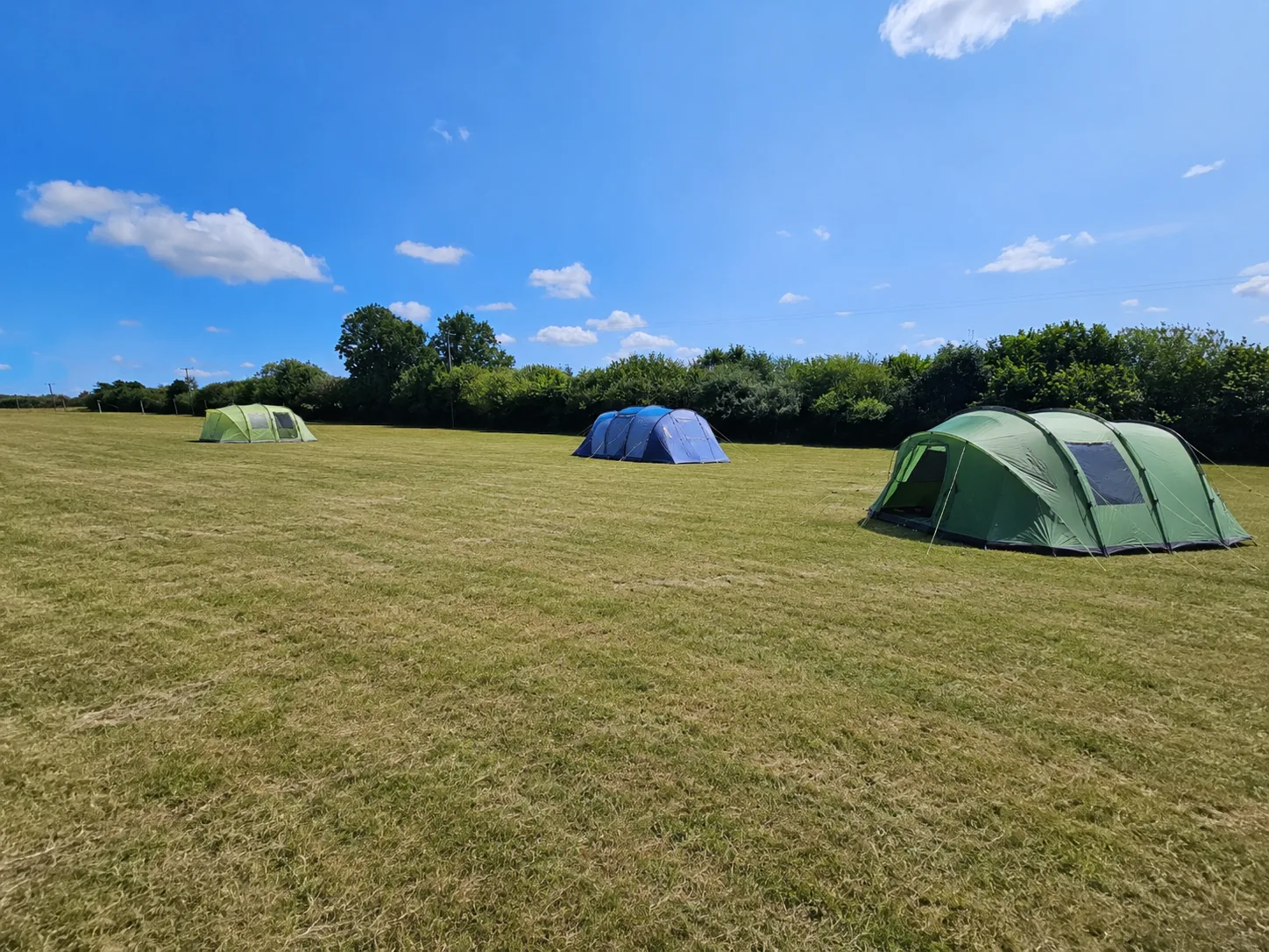 Tents pitched in the camping field at Kernow Slide